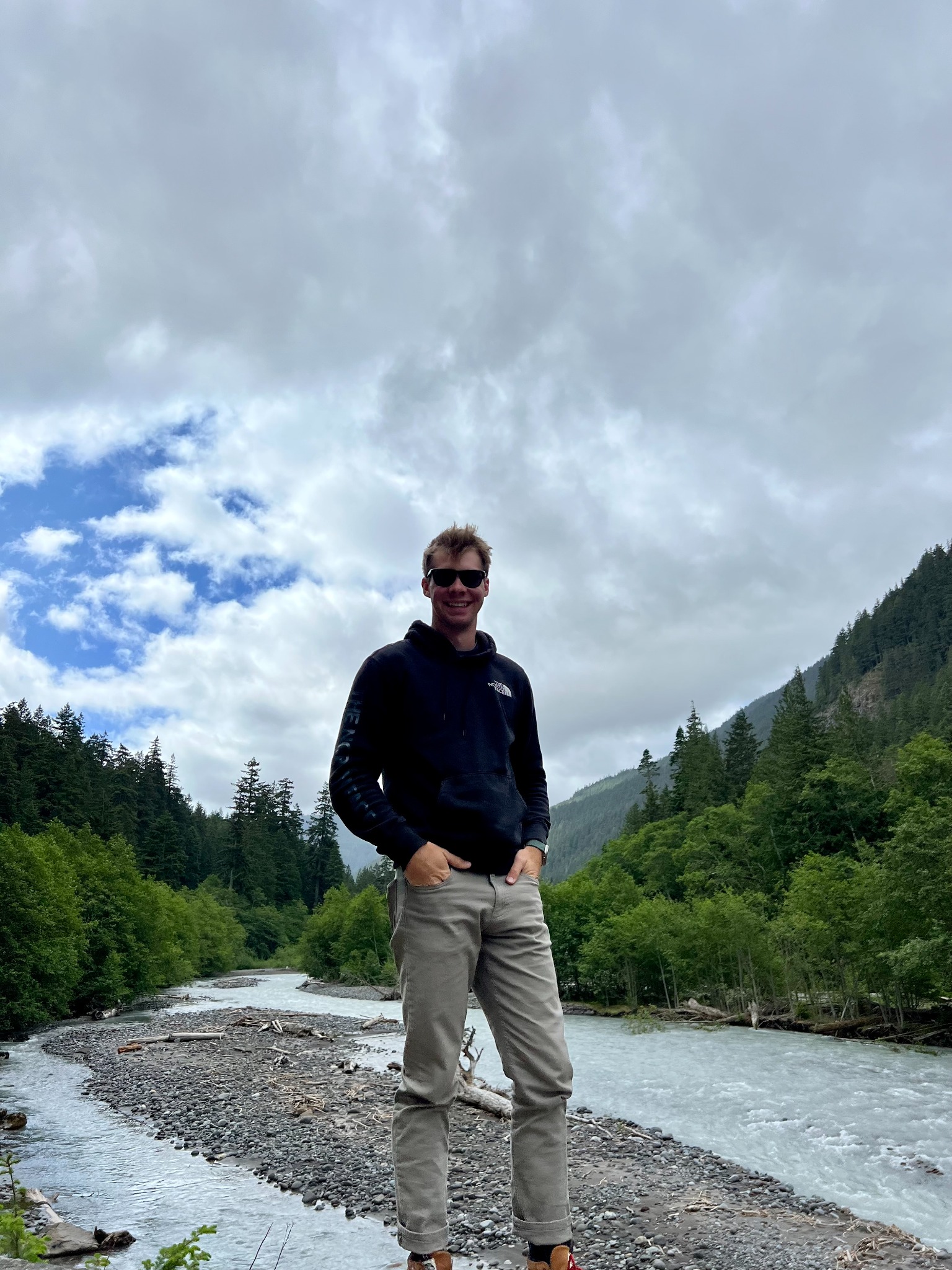 Kiefer Howland standing by a river in nature